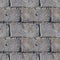 Seamless photo texture of concrete bricks with fragments of moss