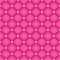 Seamless pink quilted background with pins.