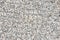 Seamless plain white gravel texture with plastic garden grate background. Top view