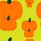 Seamless pumpkins on yellow