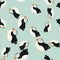 Seamless random pattern with black and white colored puffin shapes. Blue background. Atlantic zoo artwork