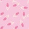 Seamless random pattern with hand drawn tulip elements. Pink flower buds with white stems. Light pink background