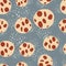 Seamless random pattern with pastel light chocolate cookies silhouettes. Red details. Blue background with splashes