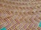 Seamless realistic bamboo weave basket repeat pattern. Texture of golden yellow rattan mat art work or interior design