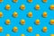 Seamless regular pattern with yellow ducks on a blue background. The concept of games in the bathroom and summer vacation