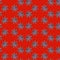 Seamless repeating pattern from ricinus communis on red background