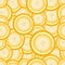 Seamless repeating pattern of slices of lemon.Vector