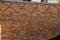 Seamless roof texture of flat red shingles with embedded line patterns