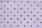 Seamless shiny polka dot wrapping paper. Lilac foil for design of gift wrapping, wrapping paper, wallpaper. Stylish shiny texture