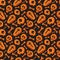 Seamless skull, bone and coffin pattern on black background in . Orange skeleton background. Bright design for textiles,