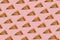 Seamless slice or piece of pizza pattern isolated on pastel pink background