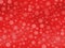 Seamless snow flakes pattern various big and small size on red gradient background.