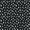 Seamless speckled pattern with white hand drawn dots. Polka dot background, white on black. Vector illustration.