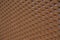 Seamless structured plastic surface in brown with a gradient from sharp foreground on the right to blurry background on the left