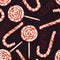 A seamless sweet pattern with the watercolor lollipop (candy cane). Painted hand-drawn on a black background.