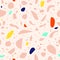 Seamless terrazzo pattern in pink, blue, yellow, red and azure. Contemporary stylish stone texture in Scandinavian style. Hand