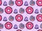 Seamless texture with cute, kawai donut and candy on pink polka background. Vector pattern