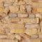 Seamless texture of sandstone masonry bricks. Background of old limestone stones brick