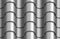 Seamless texture of silver corrugated waves rooftop background. Repeating gray pattern of silver metal tube roof tiles