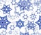 Seamless texture with snowflake fractal ornaments in dark blue and white glitter