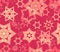 Seamless texture with snowflake fractal ornaments in red and pale gold glitter