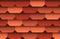 Seamless texture of soft shingles rooftop background. Repeating pattern of traditional red roof tiles