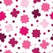 Seamless tileable pattern with puzzle pieces in pink shades