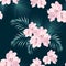 Seamless tropical vector pattern with paradise pink rhododendron flowers and exotic palm leaves on dark blue background.