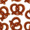 Seamless vector pattern with baked salty pretzel