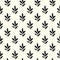 Seamless vector pattern with black leaves on white background