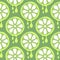 Seamless vector pattern with fruits. Symmetrical background with closeup limes on the green backdrop