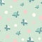 Seamless vector pattern with polka dots and butterflies in pastel teal and pink