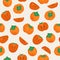 Seamless vector pattern with ripe persimmon. Whole persimmons and pieces