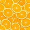 Seamless vector pattern of sliced juicy ripe oranges