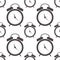 Seamless vector pattern. Symmetrical background with closeup black alarm clocks on the white background