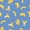 Seamless vector pattern of yellow cartoon bananas on a blue background