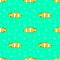 Seamless vector pattern with yellow fishes and bubbles on the green background