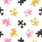 Seamless vector puzzle pattern in pink, black and golden colors