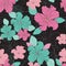 Seamless vector repeat colorful hibiscus flowers and leaf pattern on a black background.