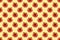Seamless vegetable pattern of red bell peppers on yellow background. Flat lay