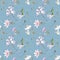 Seamless watercolor pattern with the image of beautiful wildflowers - daisies, thistles, forget-me-nots, on a blue background