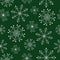Seamless winter New Year pattern with white linear patterned snowflakes on a green background. Christmas elegant and graceful prin