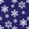 Seamless winter pattern of white openwork snowflakes