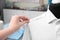 Seamstress putting pins into semi-ready shirt