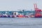 Seaplane and stacked containers in harbor