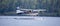 Seaplane taking off on a wild lake