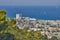 Seaport in the city of Haifa, panorama of the port and city buildings against the background of a blue sky with clouds.