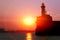 Seaport. Old lighthouse. Sunrise.