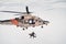 Search and rescue SAR helicopter team hoists an injured person