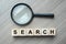 Search text wooden cubes and magnifying glass on wood table background. SEO, Idea, Vision, Strategy, Analysis, Keyword and Content